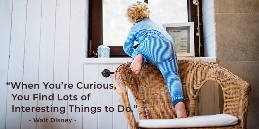 interactive toys for toddlers-block play-curiosity-toddler climbing on a chair up to a window-walt disney quote