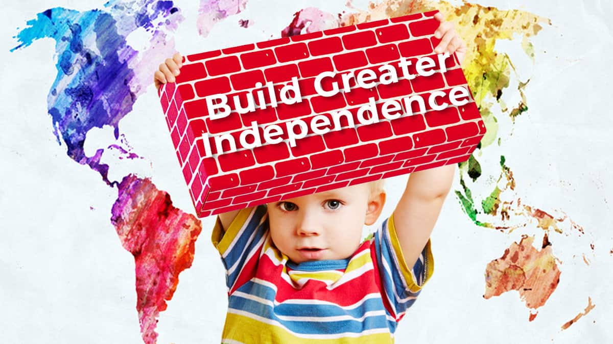 gross motor development-jumbo blocks-greater independence-toddler confidently holding up a giant building block
