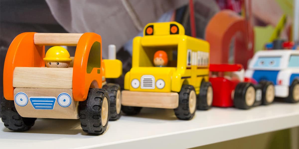 block center-block play area construction vehicles on a shelf
