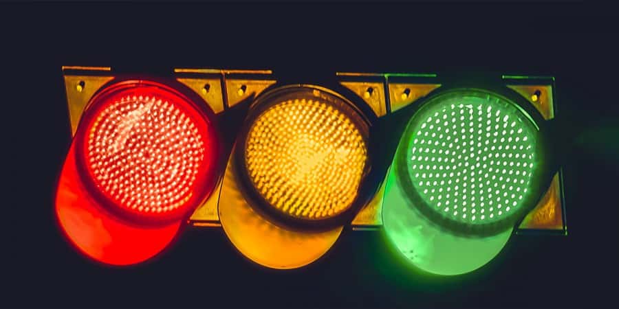 a traffic signal with a red light, green light and a yellow light used in social activities for toddlers and preschoolers