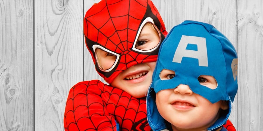 two young boys boys dressed up as superheroes for pretend play in social-emotional activities for preschoolers