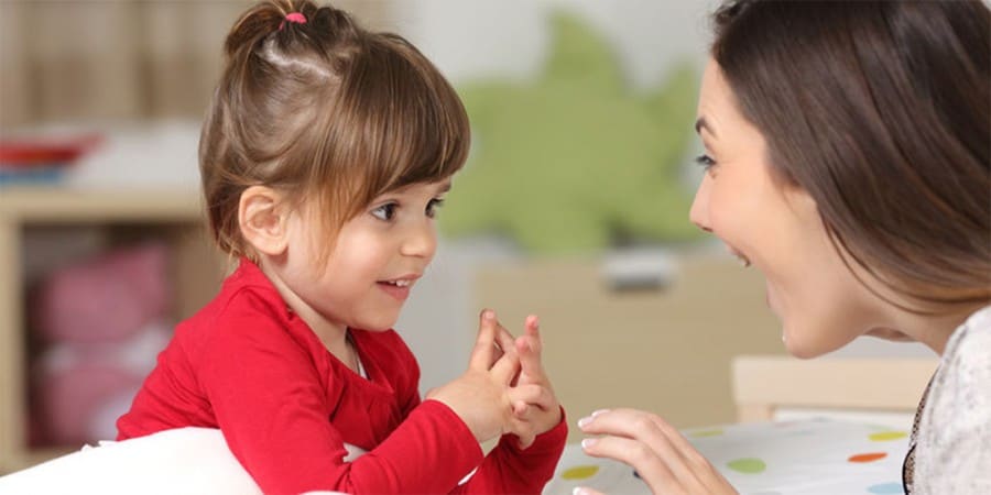 language development-communication and language skills-mother and young daughter having a conversation