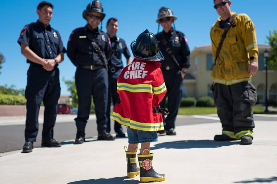 imaginative play-young boy dressed as a fireman