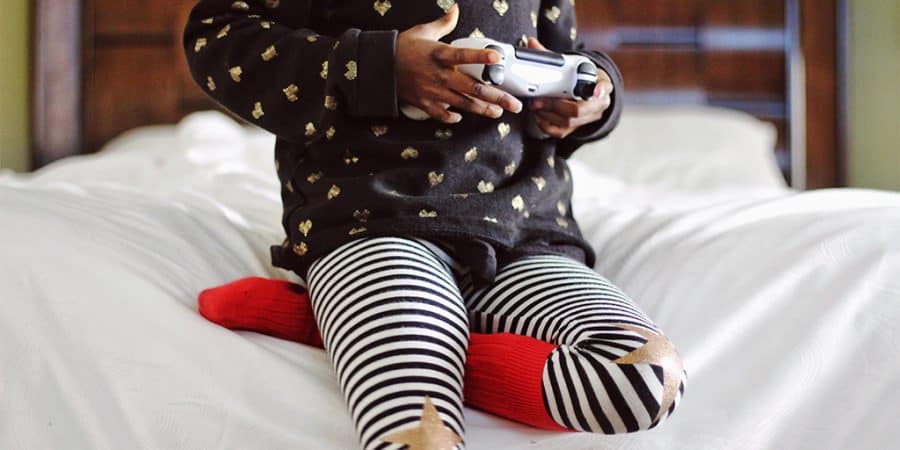 screen time for kids-young child playing  a video game