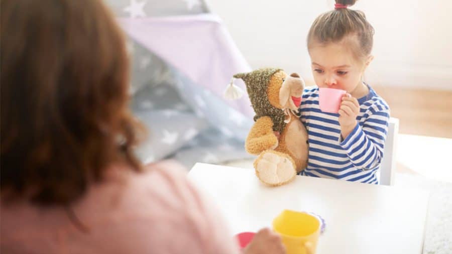 inside activities for toddlers-mother and daughter enjoying a tea party with stuffed animal friends